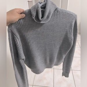 It is a hi neck top of wollen